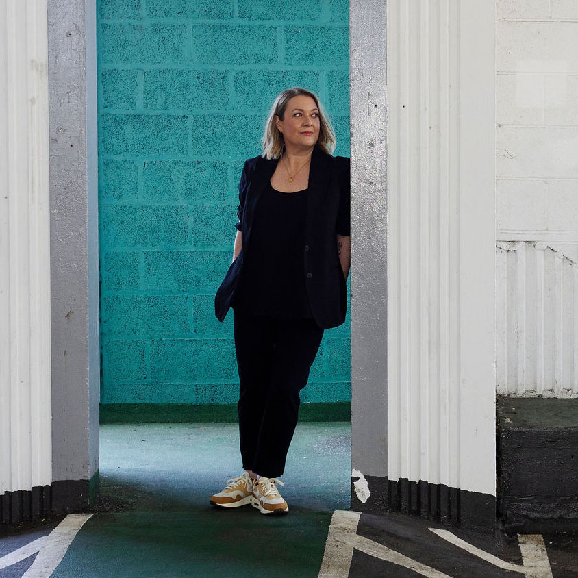The Resilient Hairdresser lent in doorway